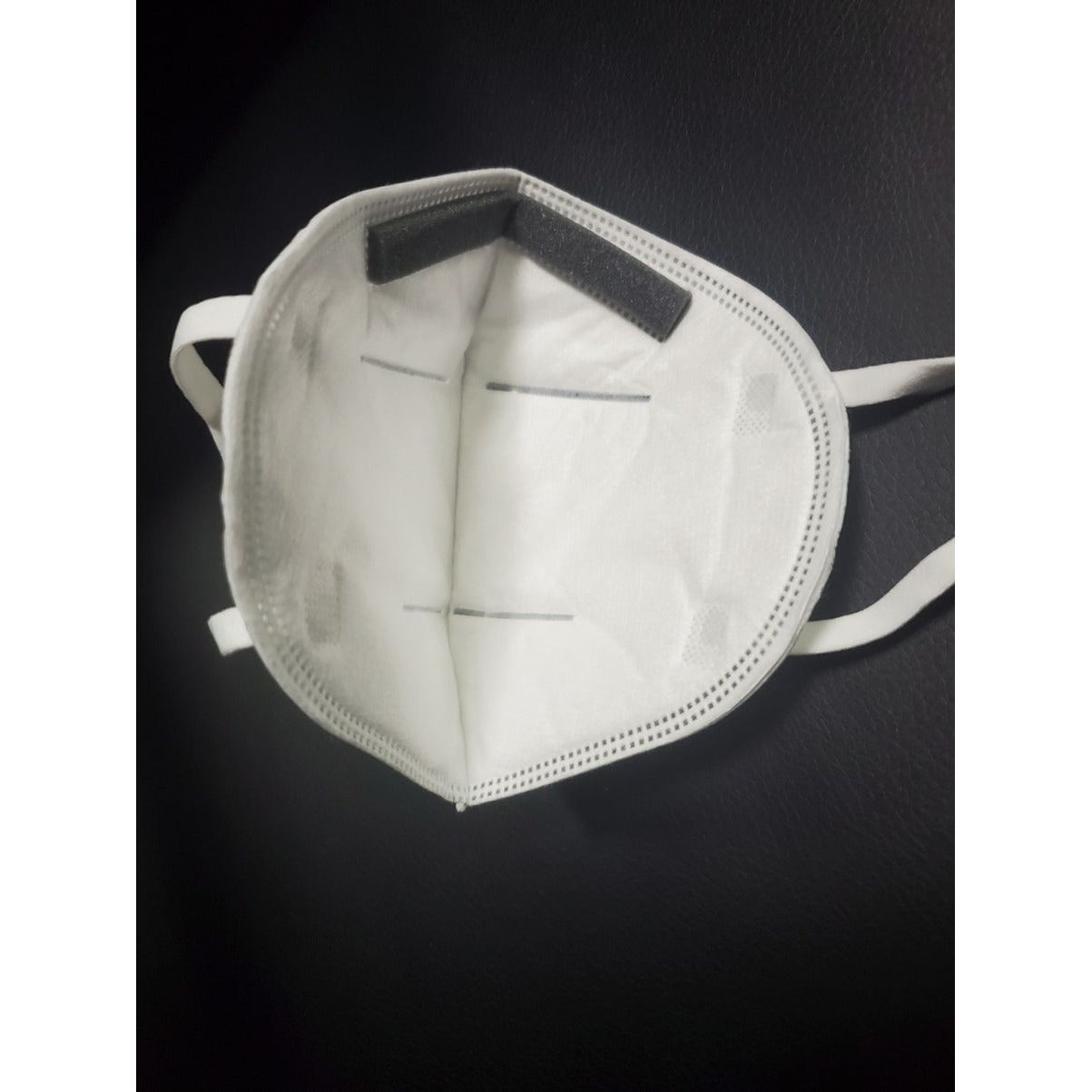 Inside view of white Powecom KN95 face mask with padding for nose